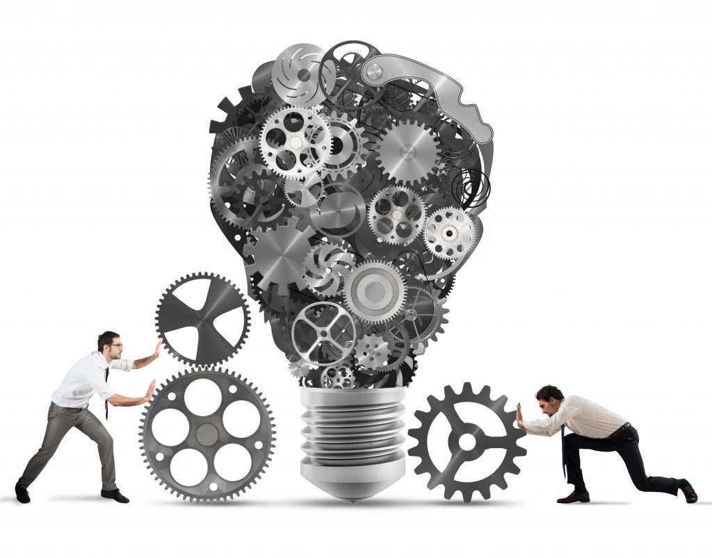 Business team push gears towards a great light bulb. build an idea concept